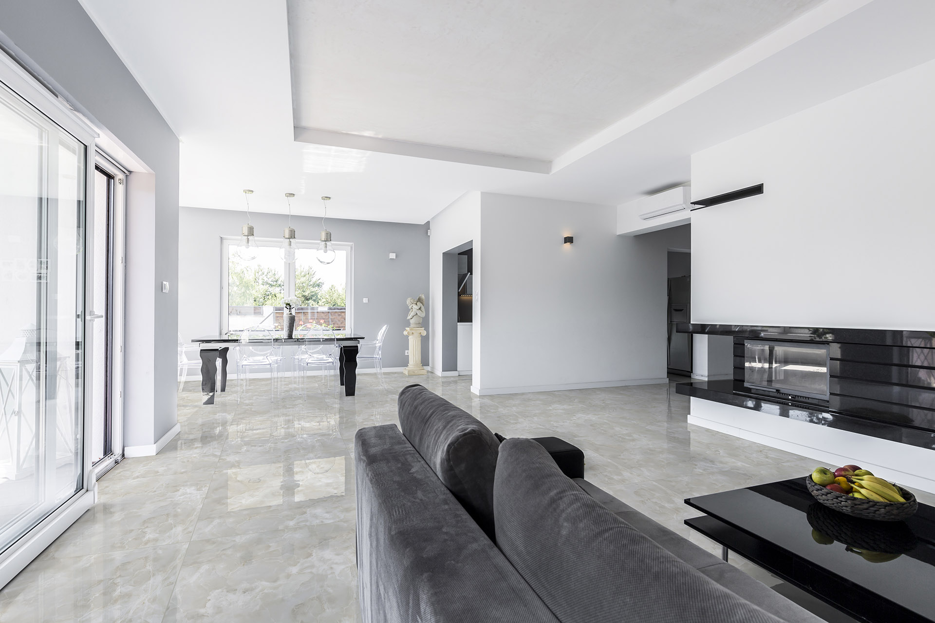Spacious living room with grey couch